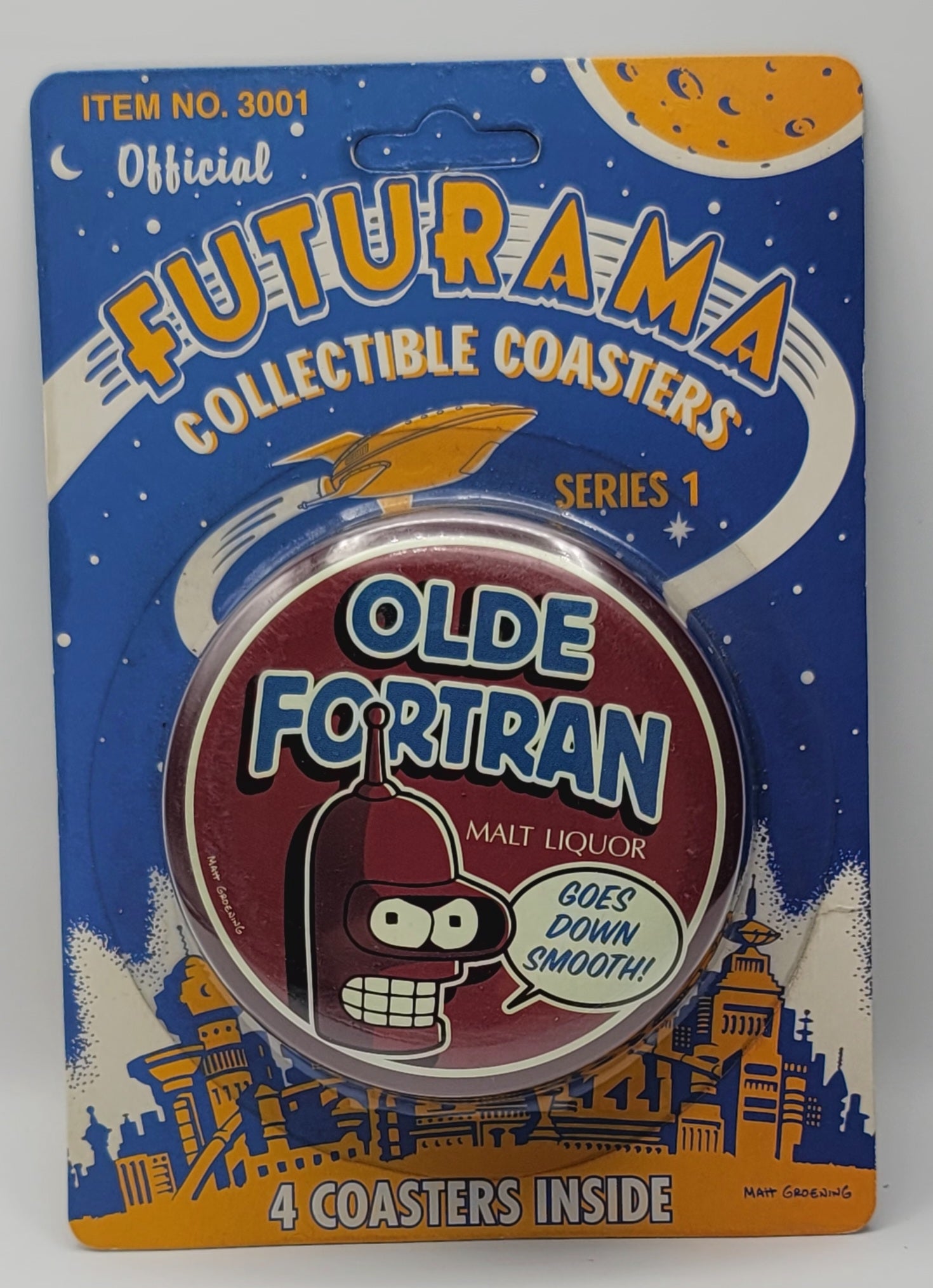 Official Futurama Collectible Coasters Series 1 package containing 'Olde Fortran' malt liquor coasters, featuring a blue card back with space-themed graphics and a central round blister pack.