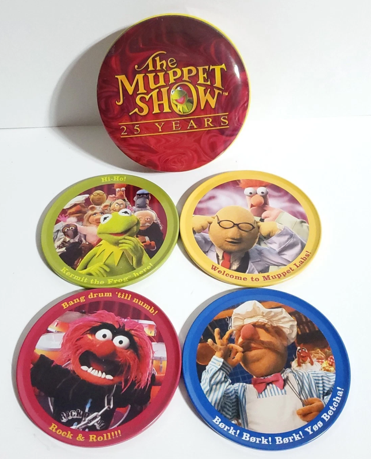 Five round Muppet-themed coasters and one round pinback button featuring characters from 'The Muppet Show 25 Years', displayed on a white background.