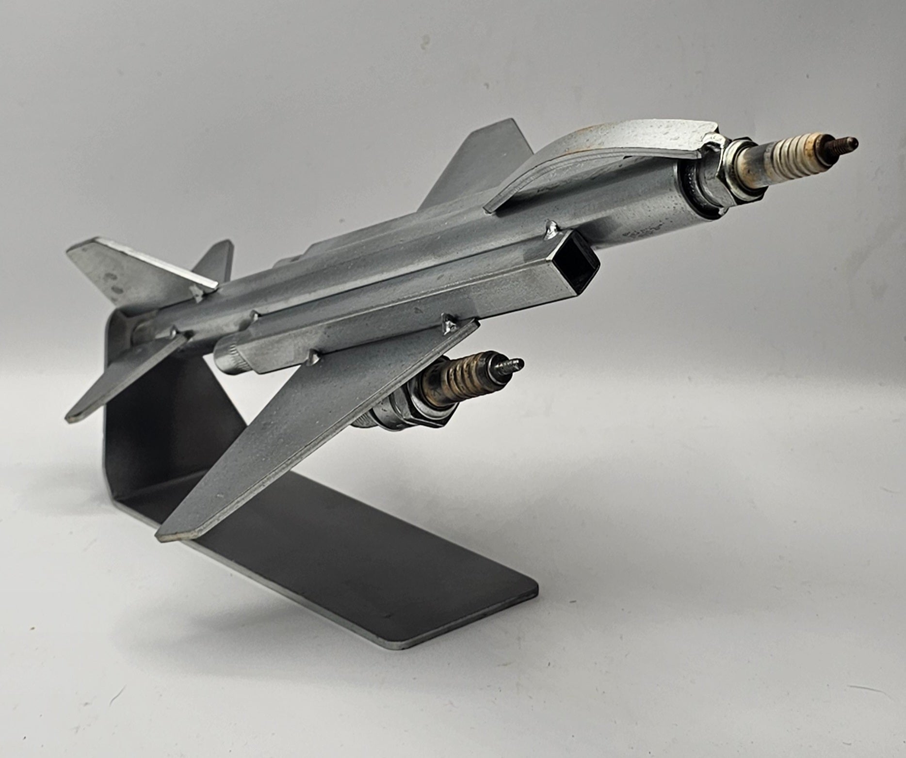 F-4 Phantom fighter jet spark plug metal art sculpture, military aviation collectible full view