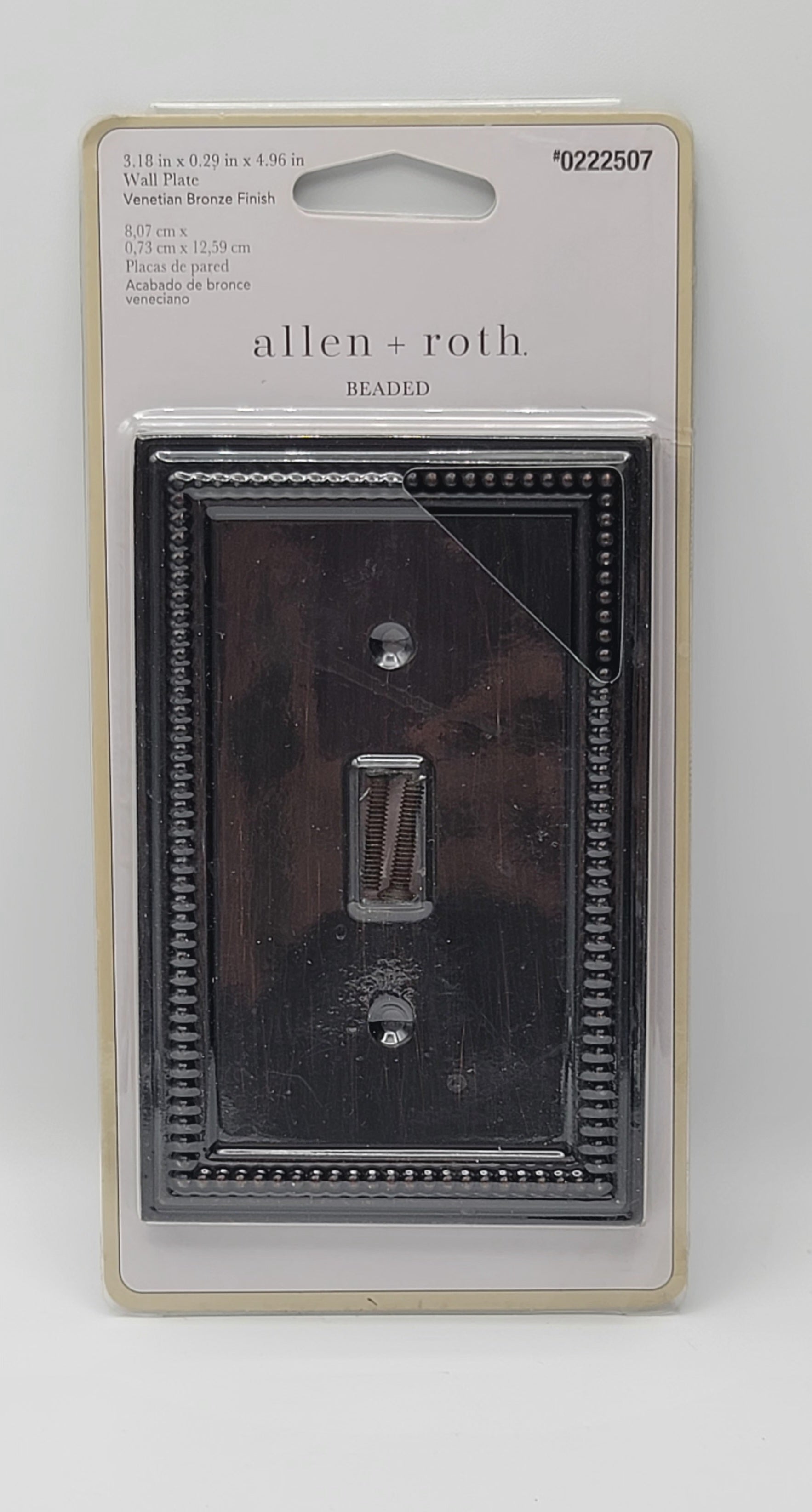 Allen Roth weathered bronze double light switch plate in its original retail packaging, showing a distressed dark bronze finish.