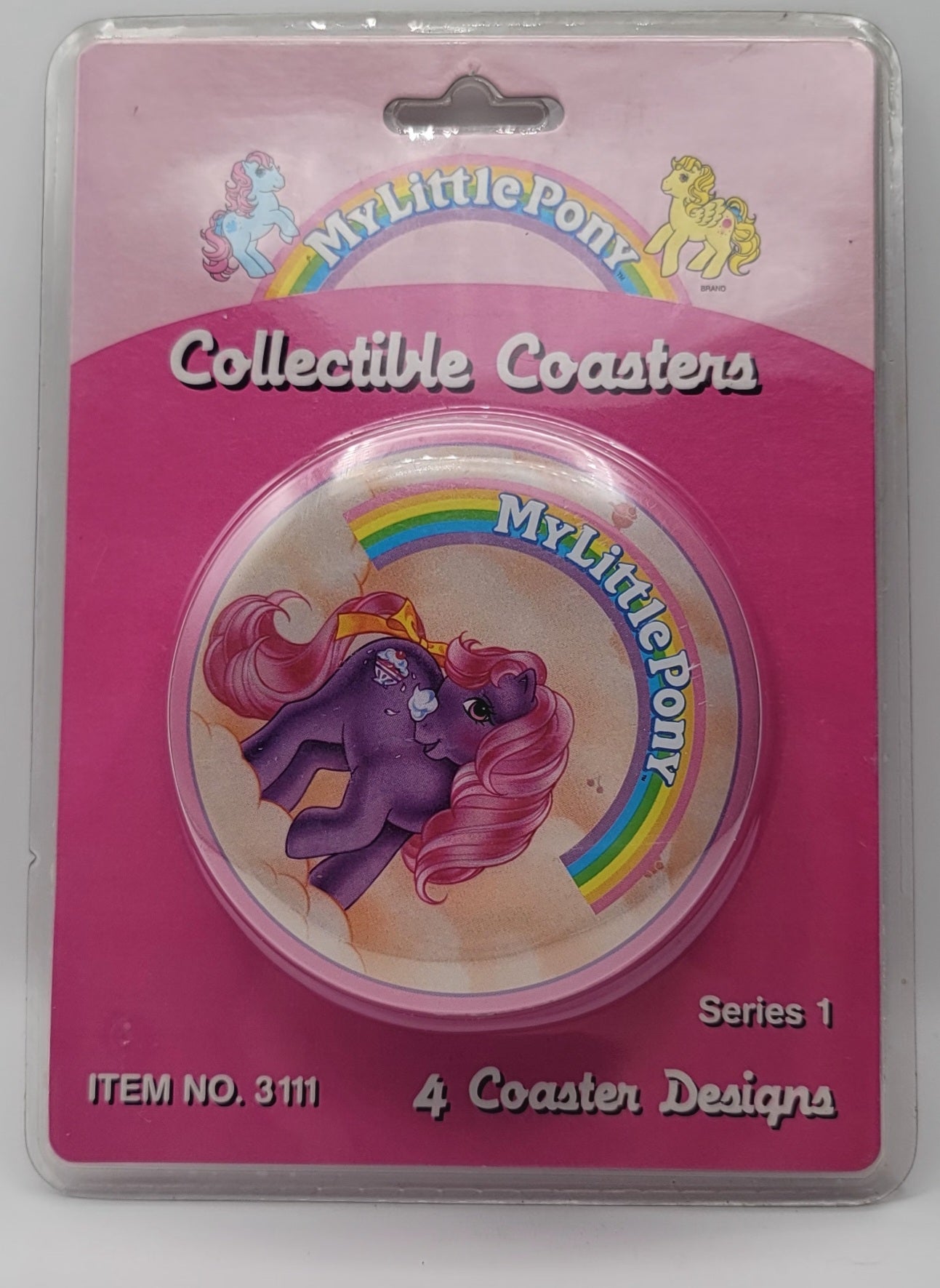 My Little Pony collectible coaster in its original blister card packaging, featuring a purple pony illustration with a rainbow and the My Little Pony logo.