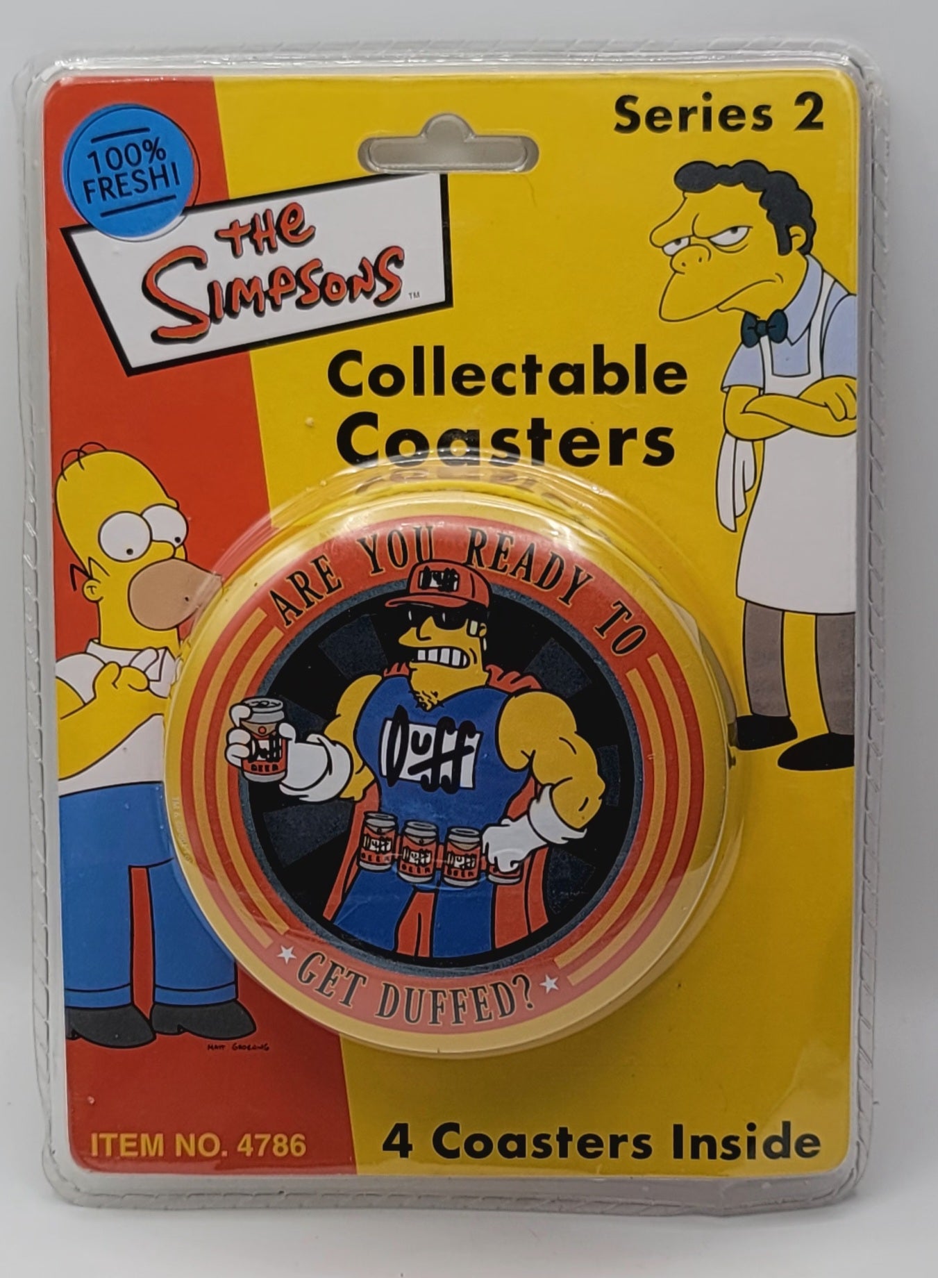 The Simpsons Collectable Coasters Series 2 in its original blister packaging, featuring a cartoon pinback coaster with Homer Simpson and text reading 'ARE YOU READY TO GET DUFFED?'.