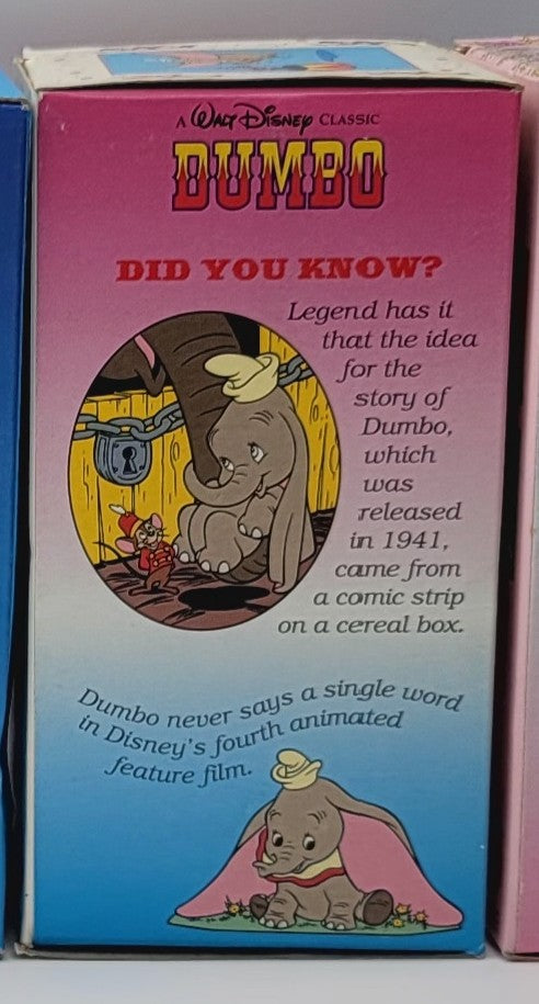 A vintage Walt Disney Classic Dumbo 'Did You Know?' card or booklet insert, showing colorful text and illustrations of Dumbo on a pink-to-blue gradient background.