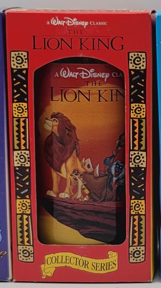 A Walt Disney Classic The Lion King Collector Series collectible bottle in its original red display box, featuring character artwork of Simba, Nala, and Kiara on the front window.