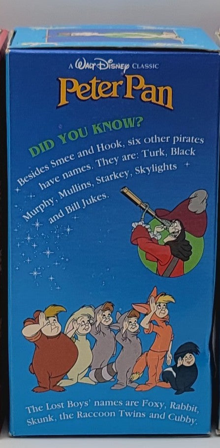 A vintage blue Peter Pan collectible box featuring Walt Disney Classic branding and illustrations of Peter Pan and the Lost Boys on the front.