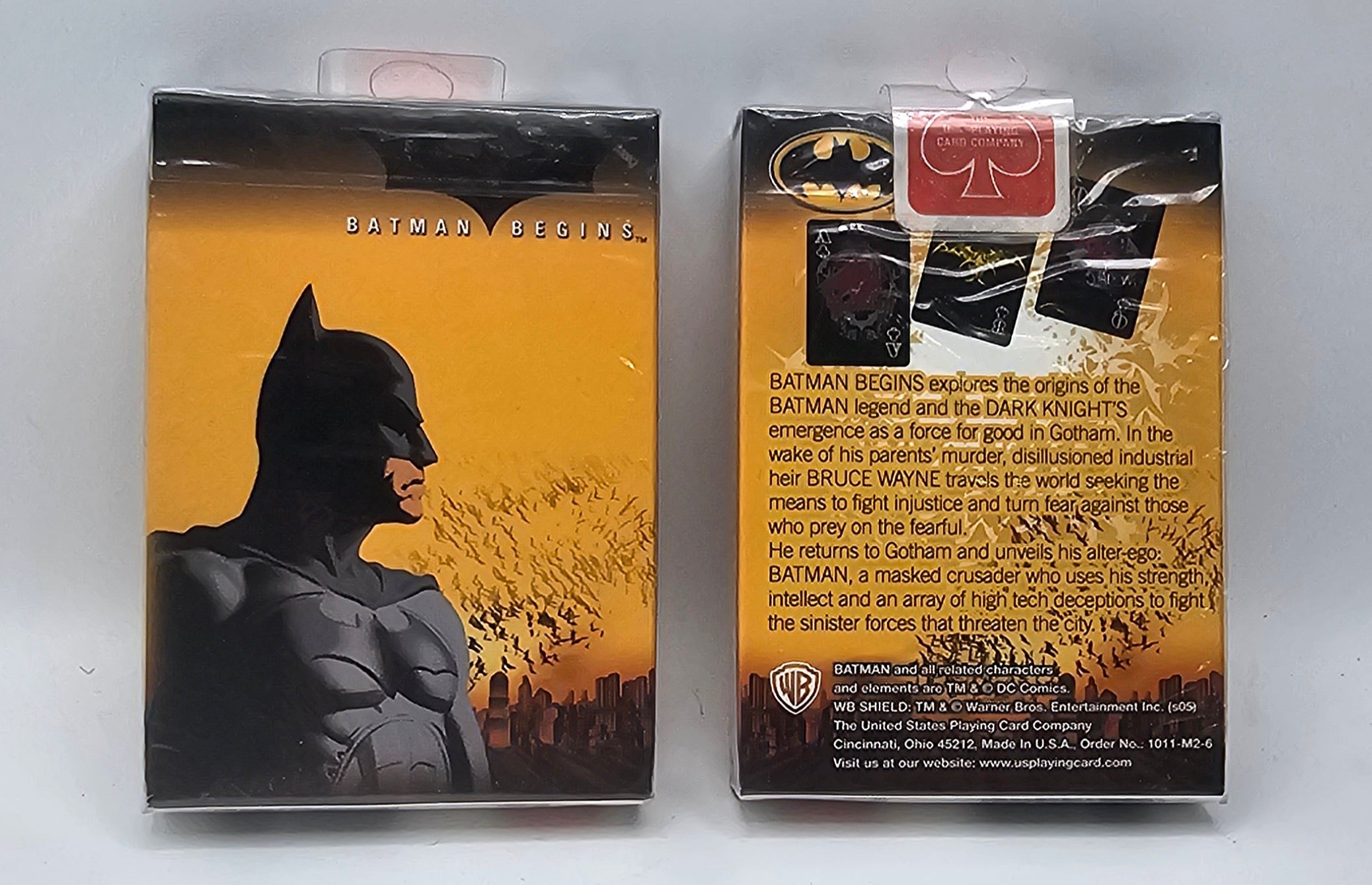 Batman Begins collectible card set in its original window box packaging, showing both the front cover with Batman's silhouette and the back with product details and a card insert.