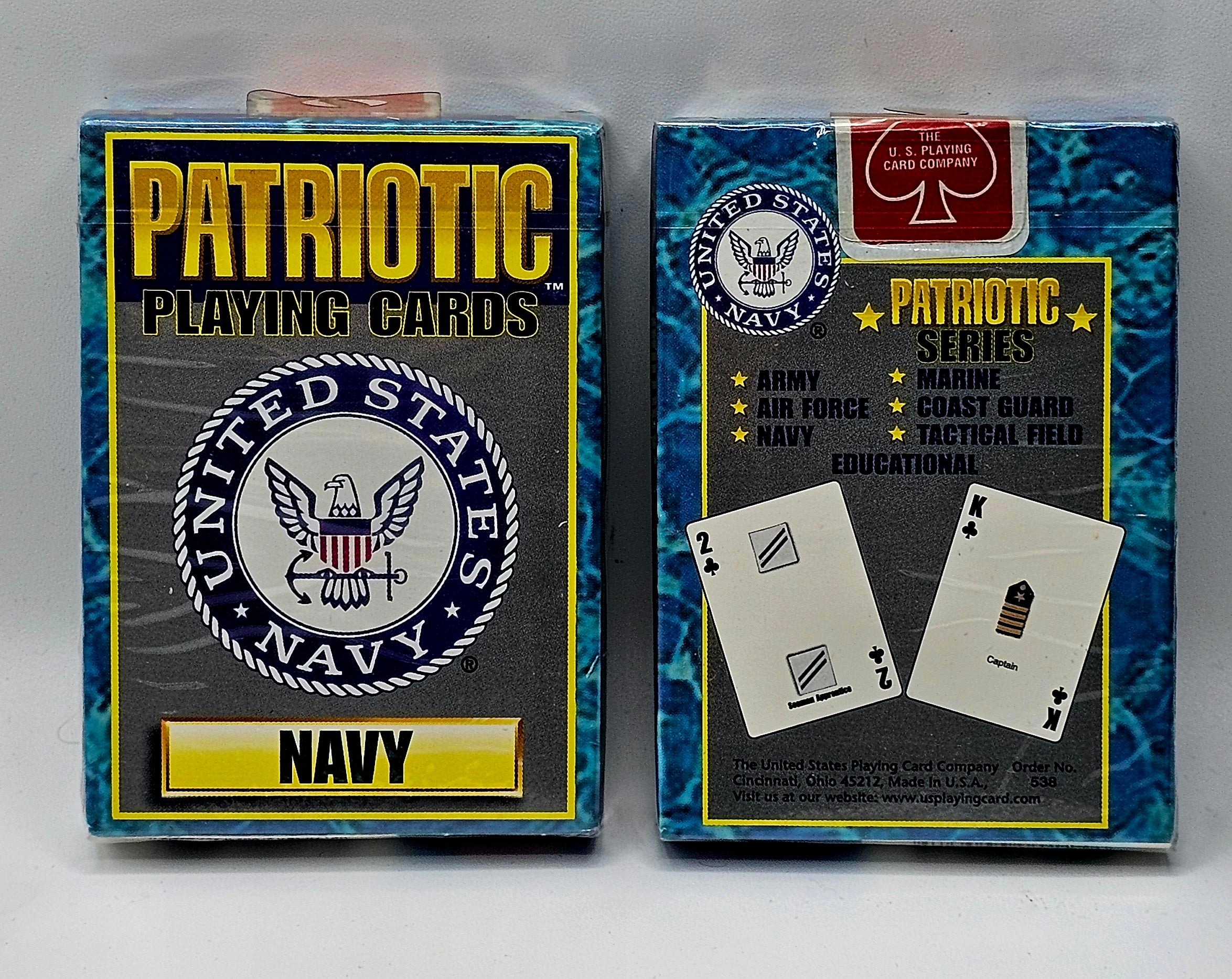 Two retail boxes of 'Patriotic Playing Cards Navy' shown side by side on a light gray background. The left box features a gold and navy design with the United States Navy emblem, and the right box has a blue marbled pattern with military branch logos and sample playing cards.