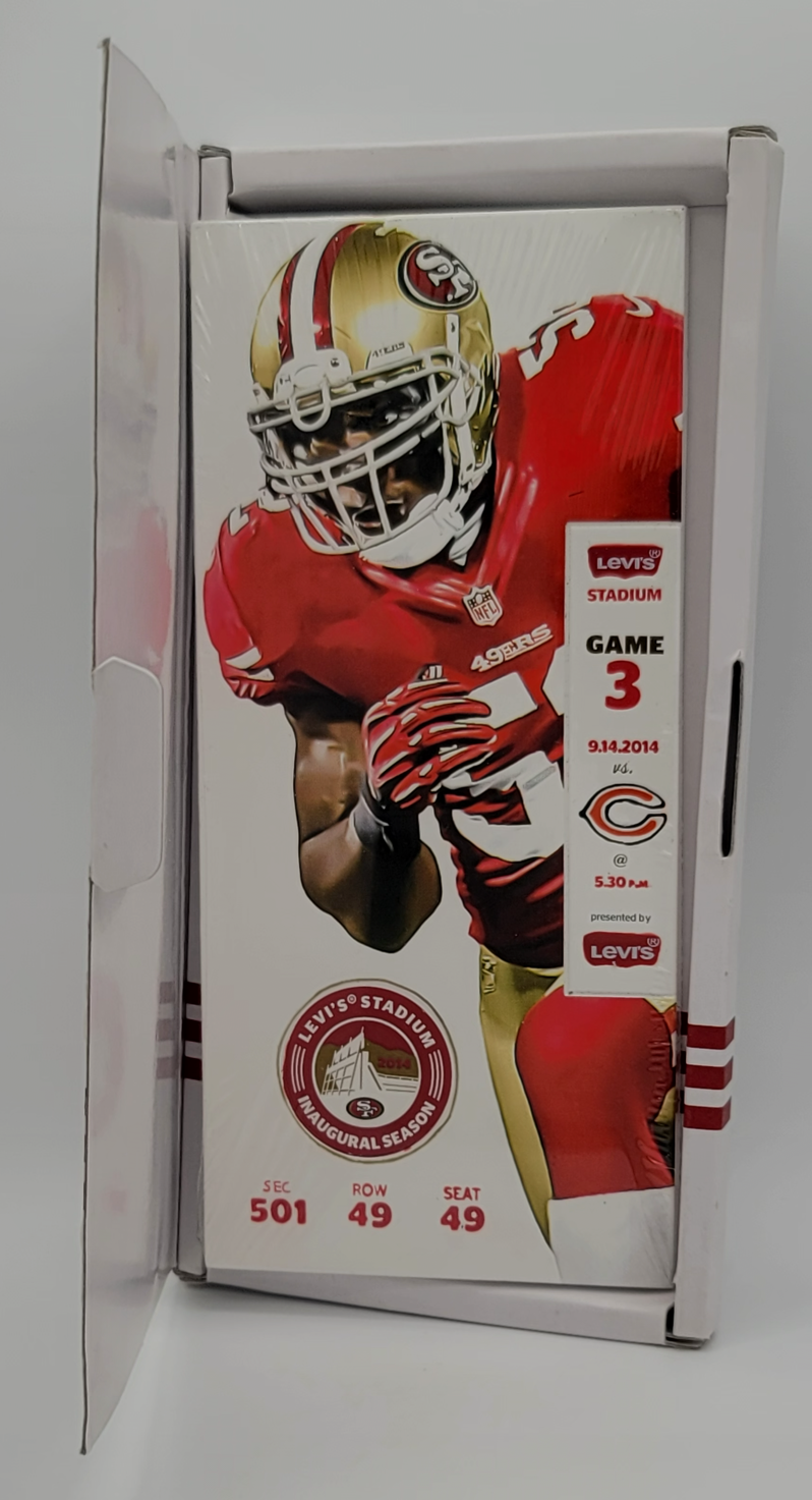 A sealed collectible football trading card inside a white display sleeve, featuring San Francisco 49ers player Brandon Harris on a card for Game 3 of the 2014 season at Caesars Stadium.