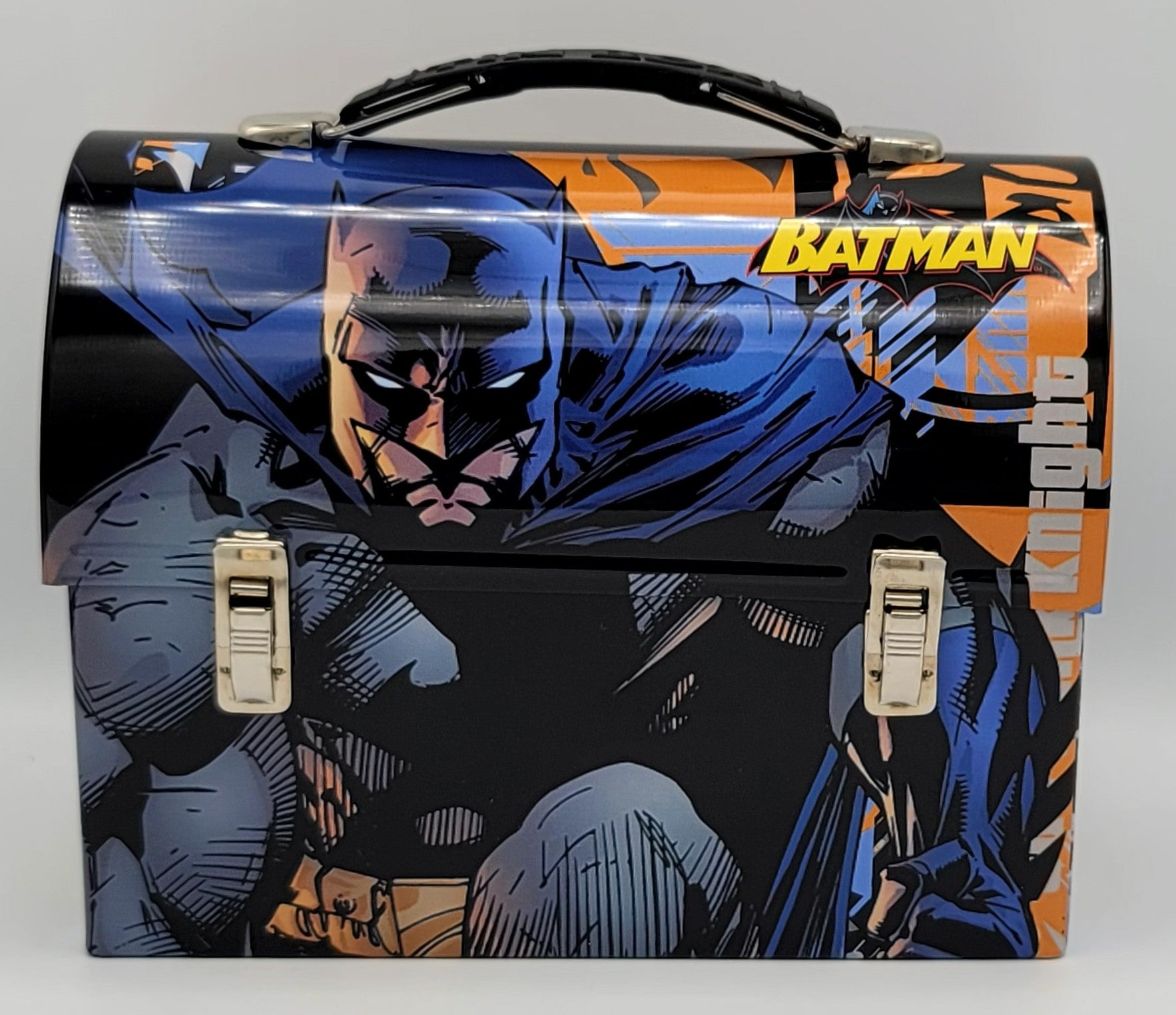 A Batman-themed metal tool box featuring comic book artwork of Batman in blue and black, with orange accents and the words 'BATMAN' and 'Knights'.
