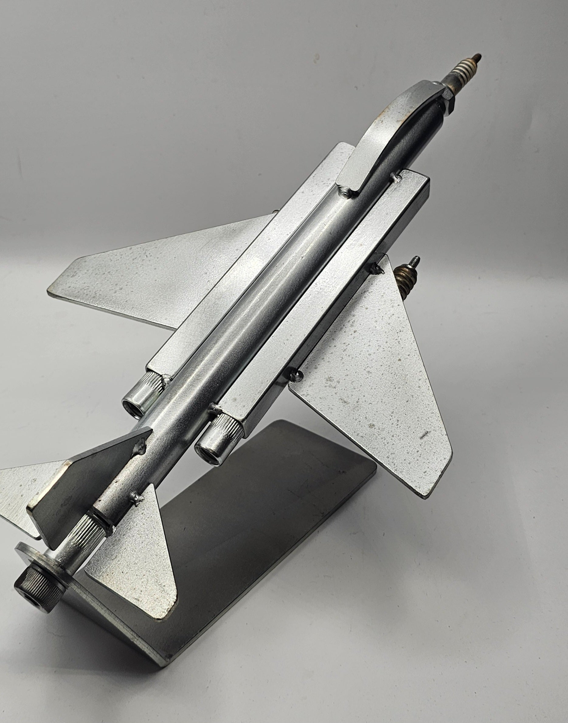 F-4 Phantom military jet spark plug sculpture, handcrafted metal airplane detail view