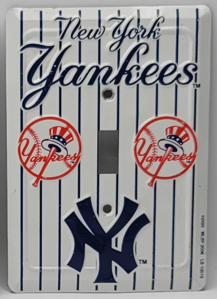 A New York Yankees themed double-gang light switch plate cover featuring the team's pinstripe design, 'New York Yankees' script logo, two circular team emblems, and a large NY logo at the bottom.